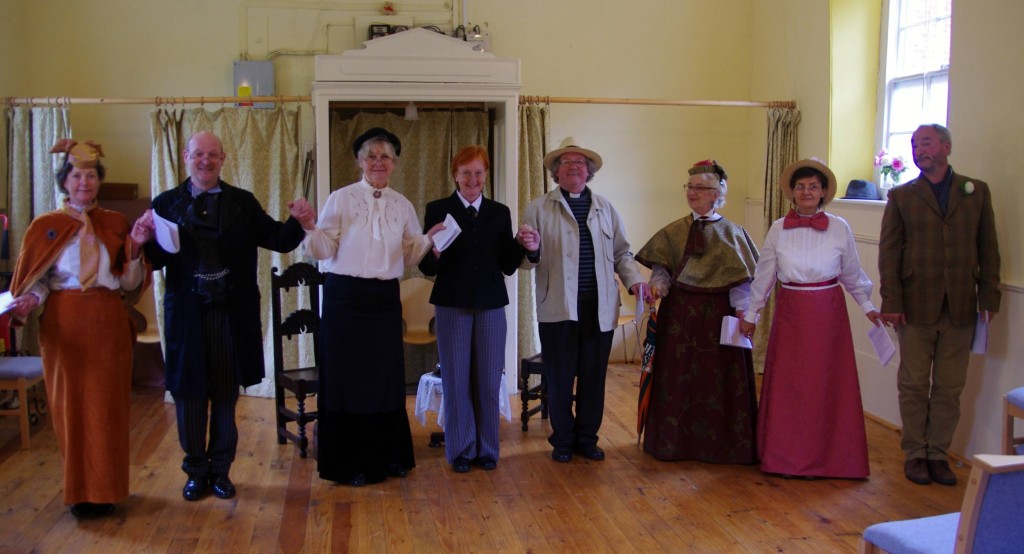The Importance of Being Earnest cast (L-R Francesca Bingham as Gwendolen, Mark Ferrero as Jack, Jacqueline Archer as Miss Prism, Sue Hopkins as the servant, Bill Huband as Canon Chasuble, Sue Huband as Lady Bracknell, Viv Simkins as Cecily, and Mark Abbott as Algernon)